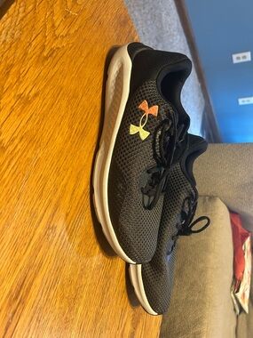 Under Armour Black Mesh Sneakers with Yellow and Orange Logo Accents